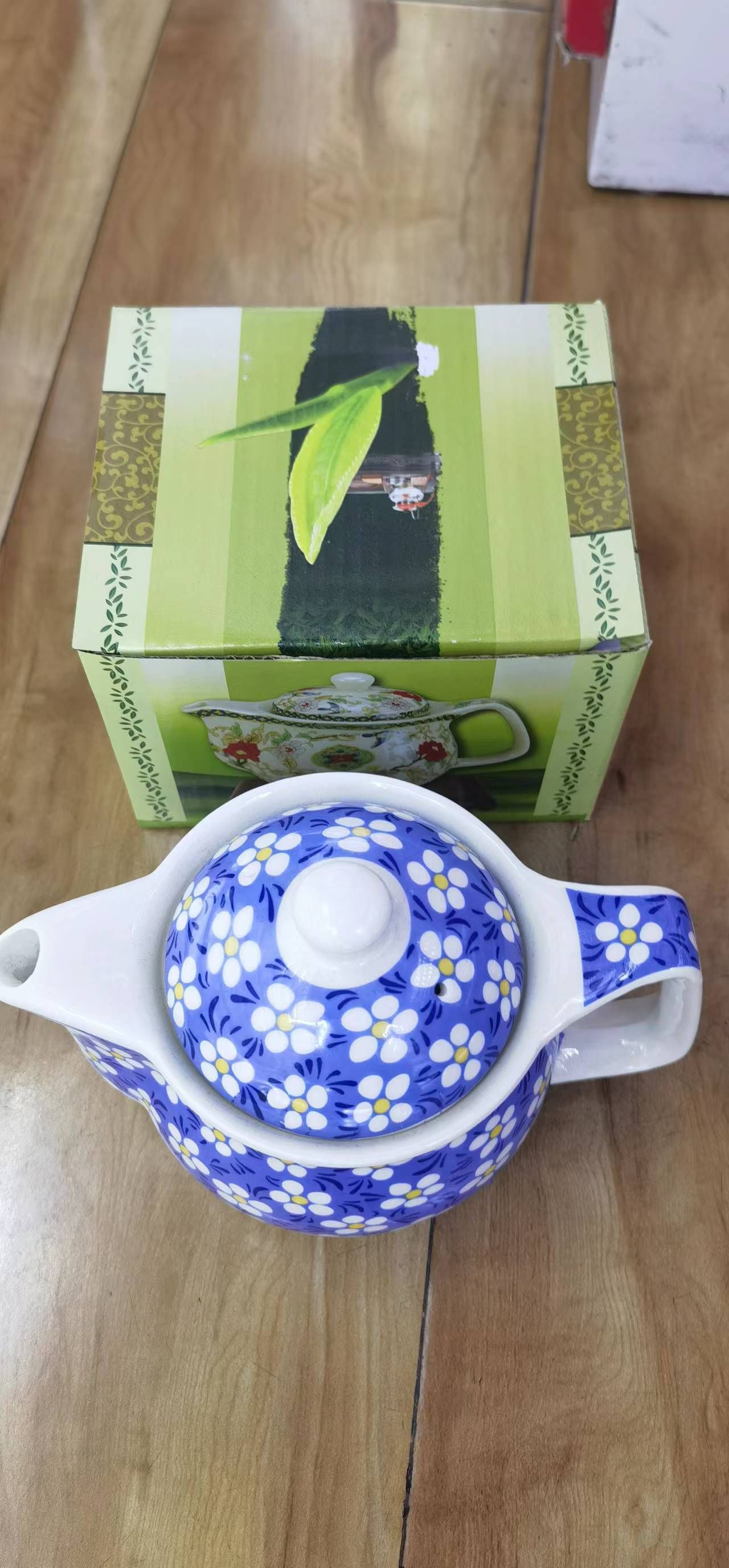 Kleine Kräuterteekanne Blaue Gänseblümchen